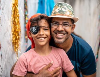 portrait of father and son at pirate festival