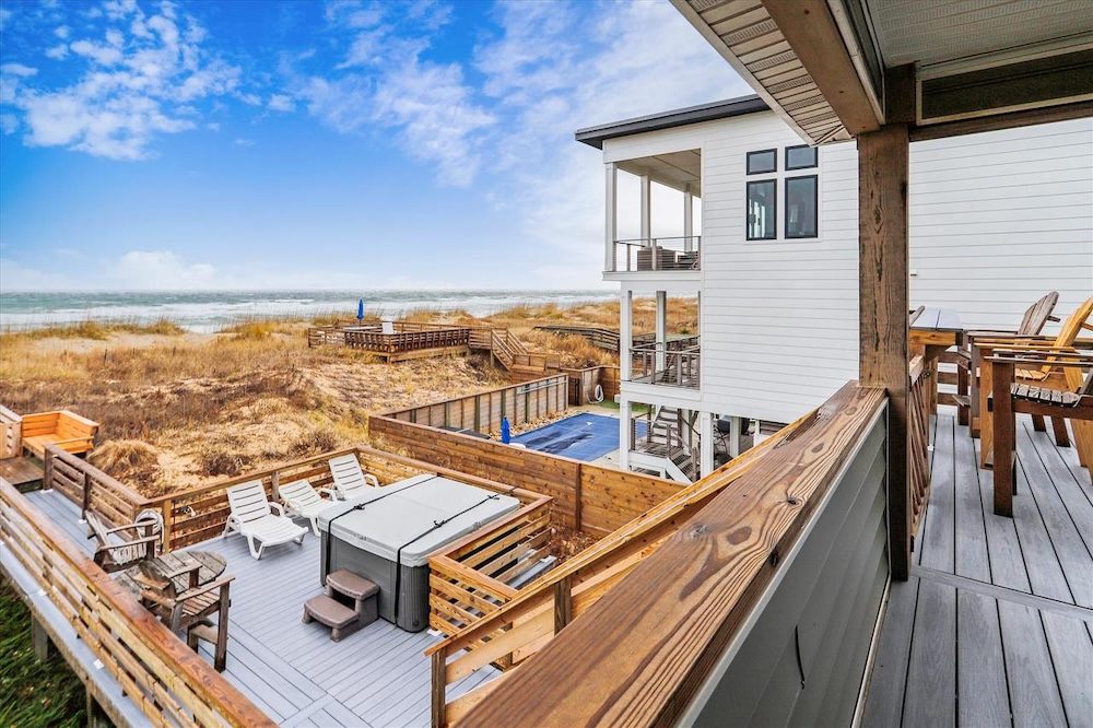 Vacation rental deck with hot tub and ocean view