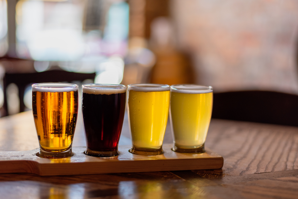 Beer tasting glasses on a table at a brewery