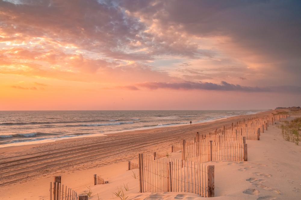 Beach at sunrise with ocean in background